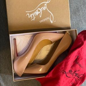 Nude louboutin pumps, worn once.